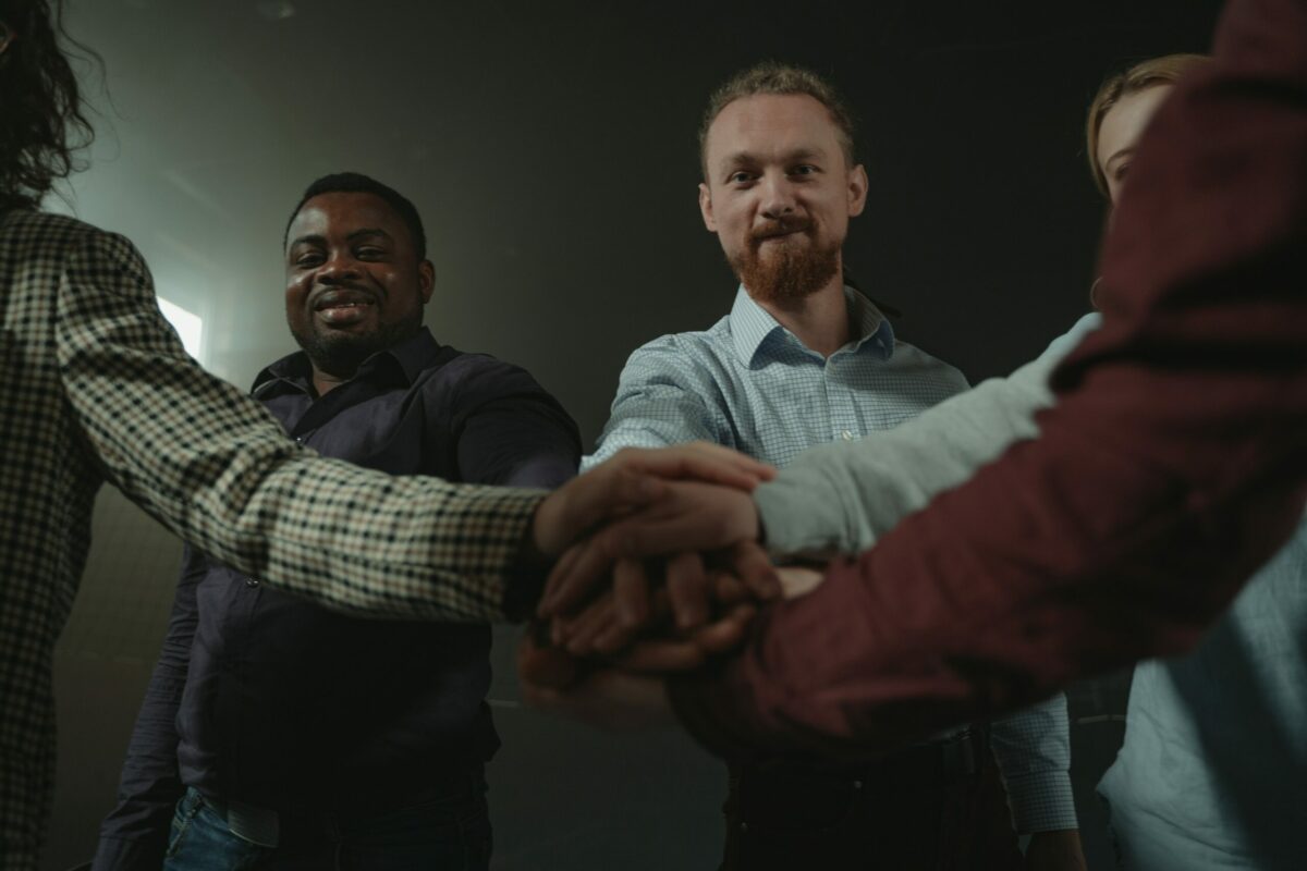 Men in group huddle