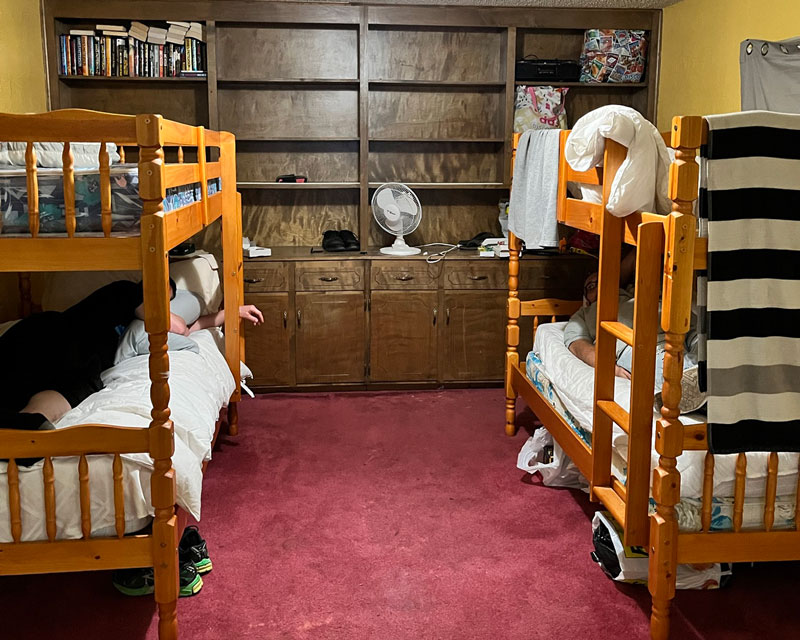 Men in bunk beds in Retraining The Village Residential Recovery home in Madera, California